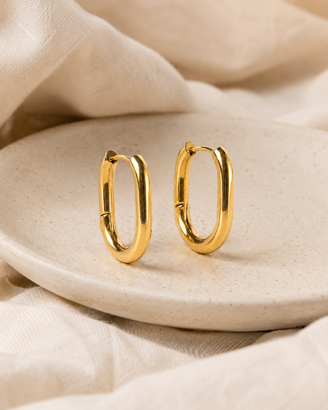 Everyday Hoops styled on soft ivory fabric.