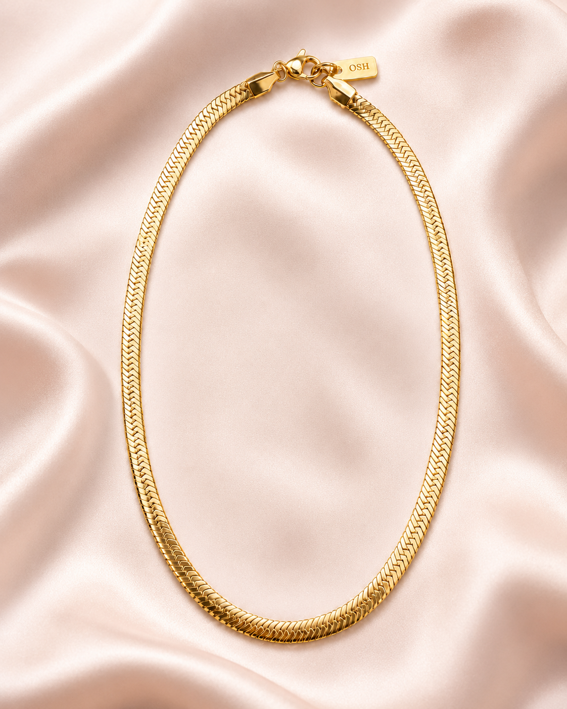 Wave Line Necklace styled on soft blush satin.