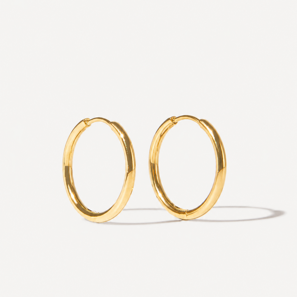 Classic everyday earrings on grey background
