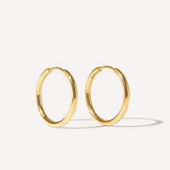 Classic everyday earrings on grey background