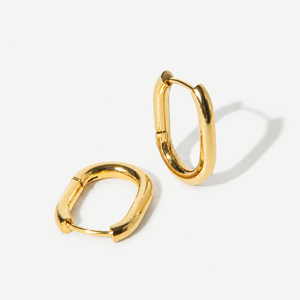 Gold hoop earrings on a white background