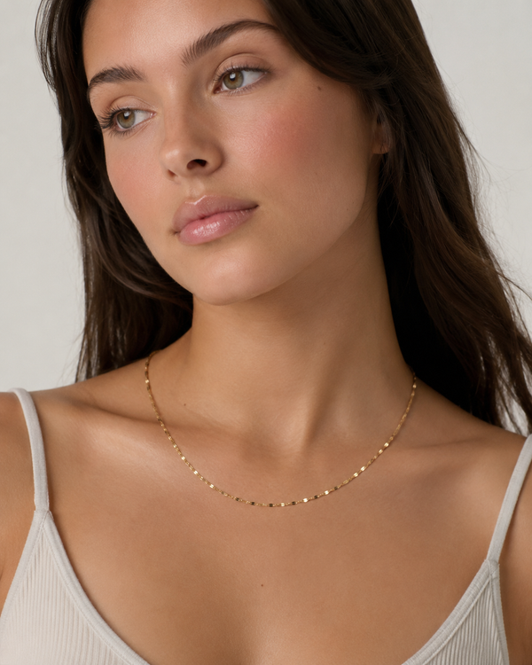 Soft Glow Necklace worn by a model with a white camisole.