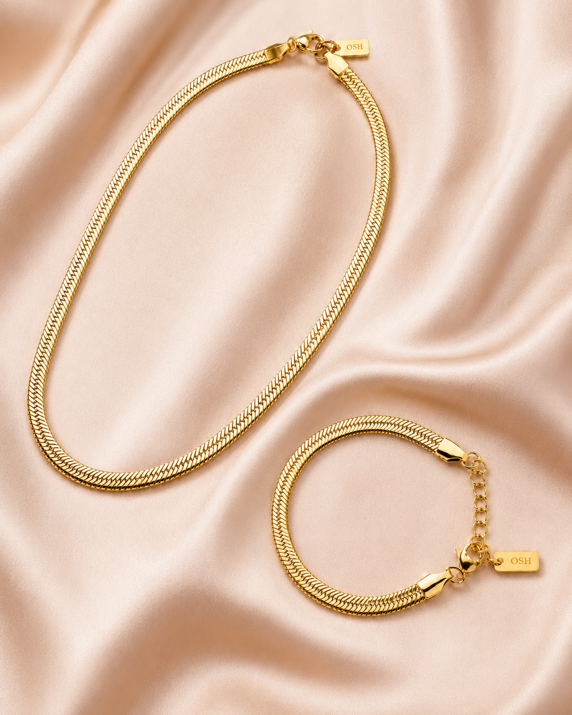 Wave Line Necklace and Bracelet Set styled on soft blush satin.