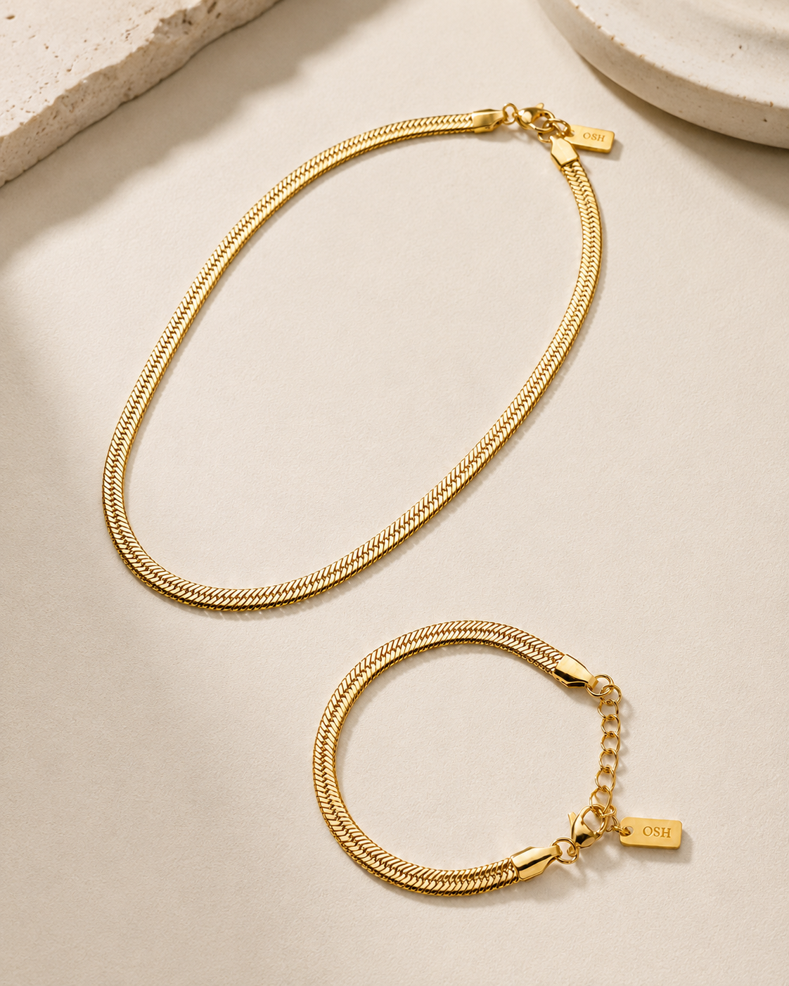 Wave Line Necklace and Bracelet Set styled on soft ivory fabric. styled